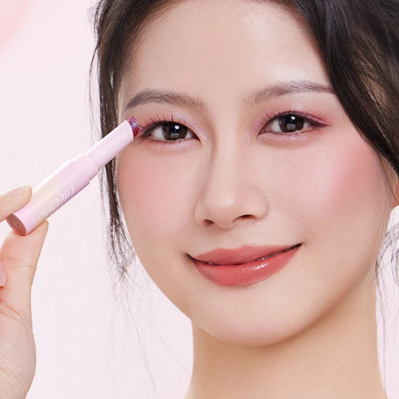 Water-Gel Eyeshadow Stick Is a Single-Swipe Makeup Highlighter Eyeshadow Stick with a Pearlescent Shimmer in Various Colors. Glowing Highlighter Eyeshadow Stick Is a Stick That Can Be Used on Both Eyebrows. The Waterproof Eff