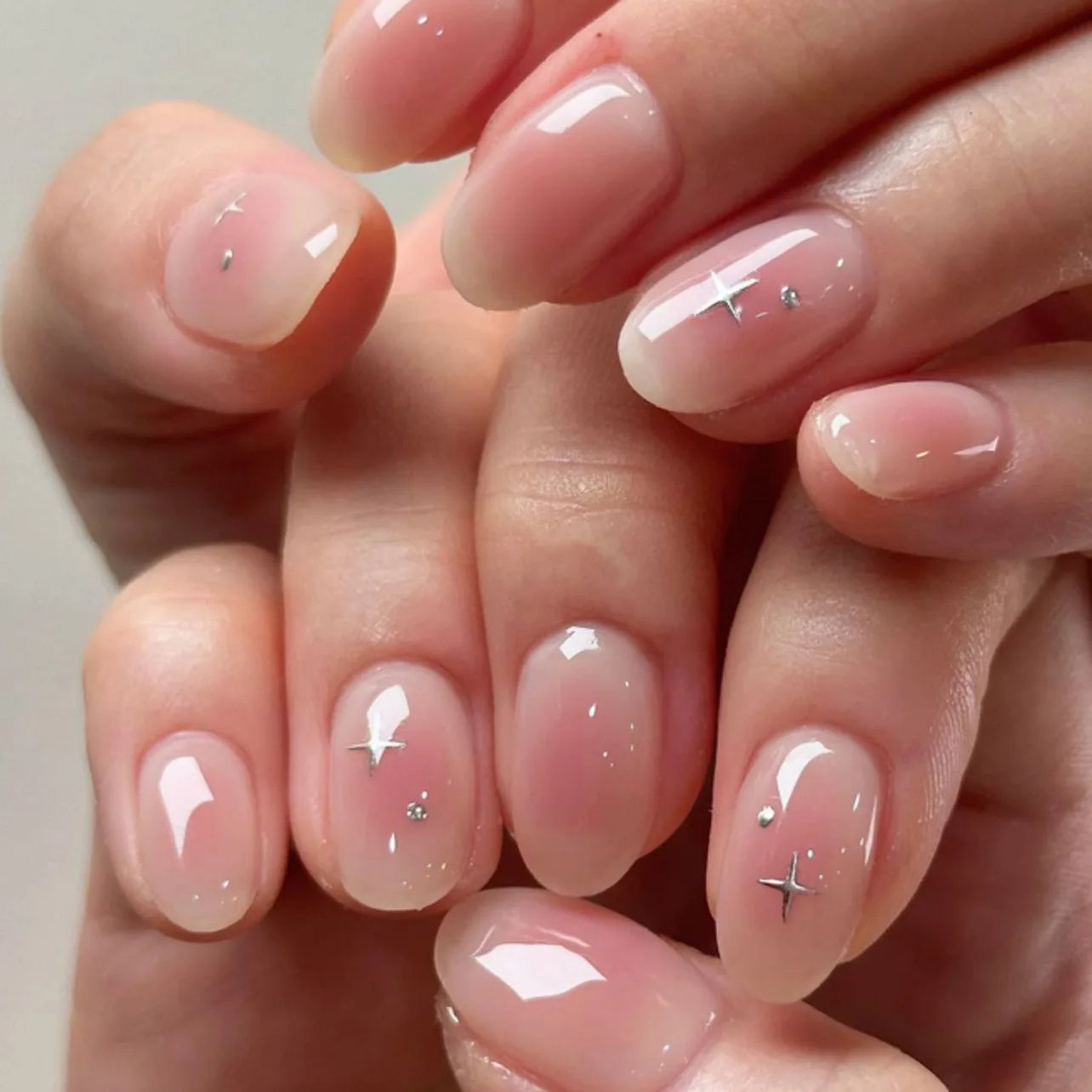 24Pcs Short Oval Head Blush Pink Press on Nails with Simple Designs Almond Nails Wearable Acrylic Full Cover Nail Tips with Glue